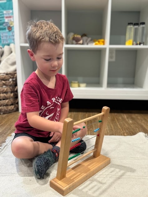 Montessori student exploring math foundations