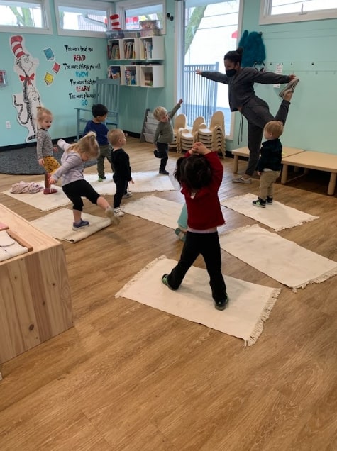 Child doing mindful movement in a Montessori classroom