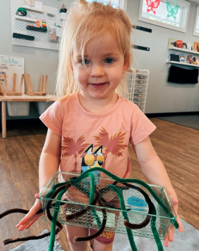 Montessori child exploring sensory materials