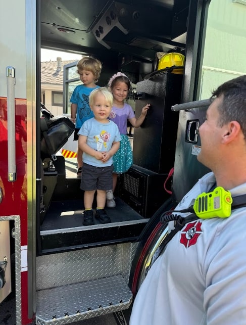 Montessori students inside a fire truck