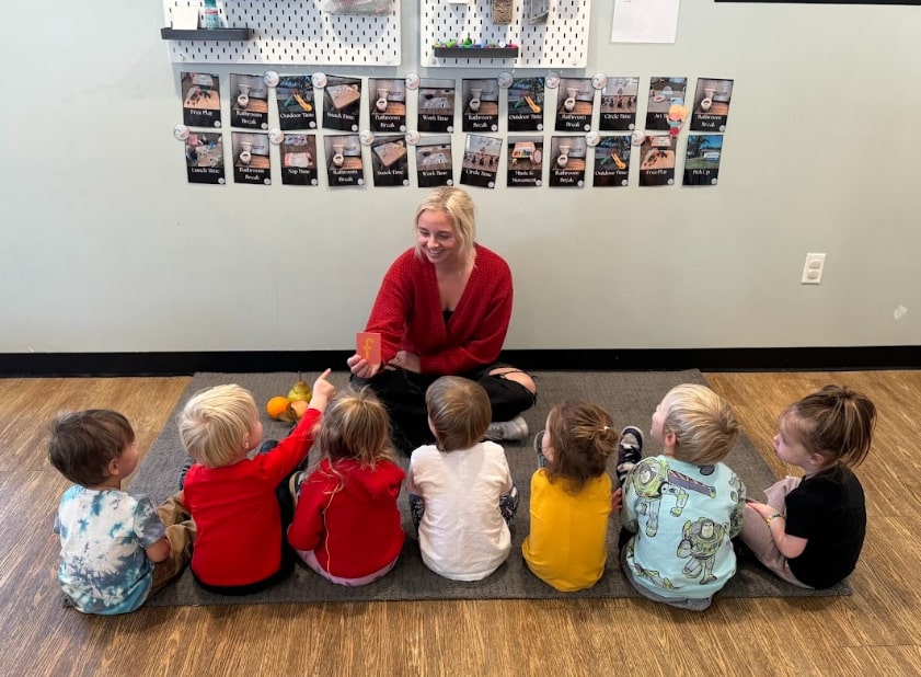 Child practicing language development with Montessori letter materials