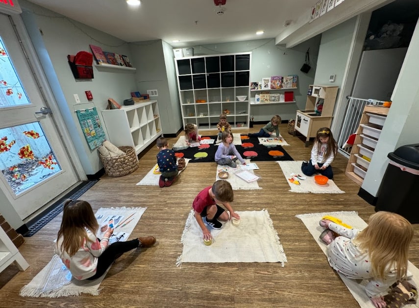 Group of happy Montessori students in a classroom setting