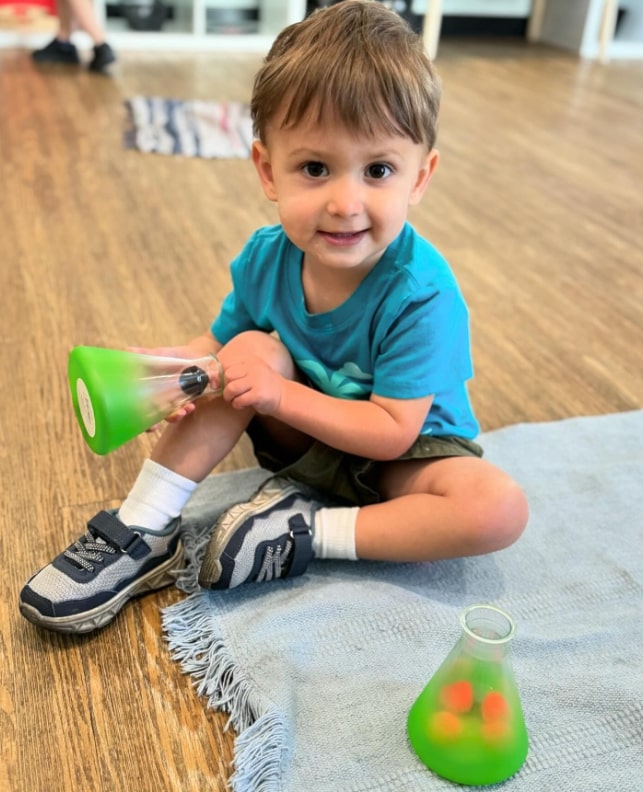 Toddler engaging in a Montessori activity